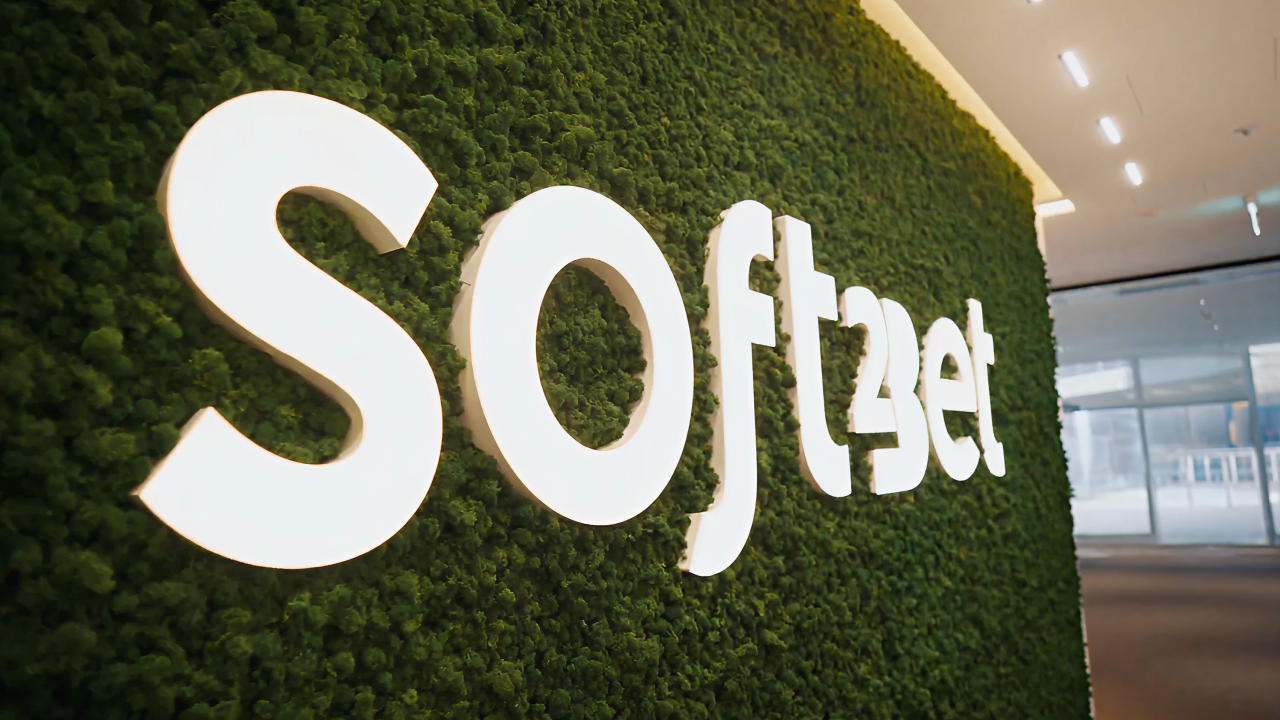 Soft2Bet Logo on Green Surface on the Left